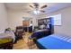 Bedroom with a ceiling fan, hardwood floors, a desk and closet at 18121 Geraci Rd, Lutz, FL 33548
