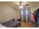 Bedroom with a ceiling fan, window, and a wardrobe at 18121 Geraci Rd, Lutz, FL 33548