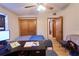 Bedroom with a closet, doorway, desk and ceiling fan at 18121 Geraci Rd, Lutz, FL 33548
