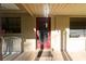 Charming front door with brick accents and a covered porch at 18121 Geraci Rd, Lutz, FL 33548