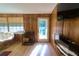 Cozy living room featuring hardwood floors and natural light at 18121 Geraci Rd, Lutz, FL 33548