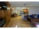 Open-concept living room with modern kitchen and breakfast bar at 18121 Geraci Rd, Lutz, FL 33548