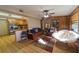 Inviting living room with hardwood floors, and a view of the modern kitchen at 18121 Geraci Rd, Lutz, FL 33548