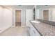 Modern bathroom with granite counters, single sink vanity, and a stand-up shower at 190 Rain Berry Ave, Ruskin, FL 33570