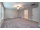 Spacious bedroom with carpet flooring, a ceiling fan, and ample natural light at 190 Rain Berry Ave, Ruskin, FL 33570