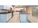 Spacious kitchen featuring stainless steel appliances, granite countertops, and white cabinetry at 190 Rain Berry Ave, Ruskin, FL 33570