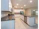 Bright kitchen with granite countertops, stainless steel appliances, and large central island at 190 Rain Berry Ave, Ruskin, FL 33570