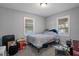 Bedroom featuring light gray carpet and neutral walls, providing a blank canvas at 19496 Wildwood Dr, Brooksville, FL 34601