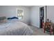 Bedroom with light gray carpet and white walls, offering a simple and clean design at 19496 Wildwood Dr, Brooksville, FL 34601