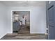 Inviting foyer with modern flooring and a glimpse into the spacious living area at 19496 Wildwood Dr, Brooksville, FL 34601