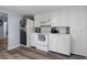 Galley-style kitchen with white cabinets and modern appliances offers a clean, functional space at 19496 Wildwood Dr, Brooksville, FL 34601