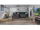 Comfortable living room with a sectional sofa, modern flooring, and a cozy atmosphere at 19496 Wildwood Dr, Brooksville, FL 34601