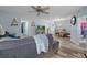 Open living room featuring modern flooring, neutral decor, and ample natural light at 19496 Wildwood Dr, Brooksville, FL 34601