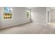 Bedroom with carpet, two windows for natural lighting and neutral walls at 20423 Symphony Pl, Venice, FL 34293
