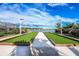 Bocce ball court by the lake with benches at 20423 Symphony Pl, Venice, FL 34293
