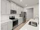 Bright kitchen featuring quartz countertops, stainless appliances and tile backsplash at 20423 Symphony Pl, Venice, FL 34293