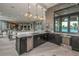 Featuring a view of the elegant countertop, wine refrigerator, and open floor plan at 20423 Symphony Pl, Venice, FL 34293