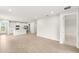 Open-concept living space with tile flooring and kitchen with island at 20423 Symphony Pl, Venice, FL 34293