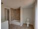 Bright bathroom featuring tiled bathtub, a toilet, and neutral paint at 2105 Sugarbush Dr, Holiday, FL 34690