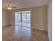 Bedroom featuring tile floors, closet and sliding glass doors to the sunroom at 2105 Sugarbush Dr, Holiday, FL 34690