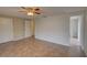 Spacious bedroom with tiled floor, ceiling fan and two large closets at 2105 Sugarbush Dr, Holiday, FL 34690
