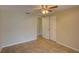 Bedroom featuring neutral walls, tile flooring, and a ceiling fan at 2105 Sugarbush Dr, Holiday, FL 34690