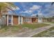 Charming single-story home with well-maintained landscaping and a welcoming entrance at 2105 Sugarbush Dr, Holiday, FL 34690