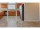 Open kitchen featuring wood cabinets, granite counters, and stainless steel appliances at 2105 Sugarbush Dr, Holiday, FL 34690