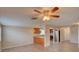Open living space with granite countertops and stainless steel appliances in kitchen at 2105 Sugarbush Dr, Holiday, FL 34690