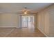 View of the living room with sliding glass doors to the screened-in patio at 2105 Sugarbush Dr, Holiday, FL 34690