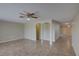 Open living space with large brick accent wall and arched openings at 2105 Sugarbush Dr, Holiday, FL 34690