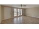 Neutral living area featuring tile floors, neutral colors, and natural light at 2105 Sugarbush Dr, Holiday, FL 34690