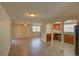 Open-concept living area with tile flooring and arched doorways to other rooms at 2105 Sugarbush Dr, Holiday, FL 34690