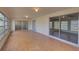 Enclosed sun room with brick flooring and sliding glass doors at 2105 Sugarbush Dr, Holiday, FL 34690