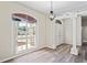 Bright foyer with hardwood floors, a chandelier and a large window at 223 Eastpoint Ct, Spring Hill, FL 34606