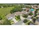 Aerial view of property highlighting proximity to green space in a well-maintained neighborhood at 2387 Bartolo Dr, Land O Lakes, FL 34639