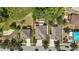 Aerial view showing property lines, landscaping, and proximity to neighboring houses and green spaces at 2387 Bartolo Dr, Land O Lakes, FL 34639