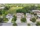 Aerial view of property highlighting proximity to green space in a well-maintained neighborhood at 2387 Bartolo Dr, Land O Lakes, FL 34639
