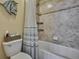 Full bath featuring stylish decor and tiled shower with tub at 2387 Bartolo Dr, Land O Lakes, FL 34639