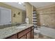 Bathroom featuring granite countertops and a shower-tub combination at 2387 Bartolo Dr, Land O Lakes, FL 34639