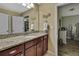 Bathroom featuring granite countertops and decorative accents at 2387 Bartolo Dr, Land O Lakes, FL 34639