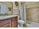 Bathroom featuring a granite vanity and tiled shower at 2387 Bartolo Dr, Land O Lakes, FL 34639