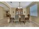 Elegant dining room with a wooden table, chairs, and decorative hutch at 2387 Bartolo Dr, Land O Lakes, FL 34639