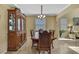 Formal dining room featuring a large cabinet and classic decor at 2387 Bartolo Dr, Land O Lakes, FL 34639