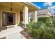 Charming front porch with meticulously maintained landscaping and a welcoming entrance to the home at 2387 Bartolo Dr, Land O Lakes, FL 34639