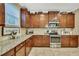 Beautiful kitchen featuring granite countertops, stainless steel appliances, and ample cabinet space at 2387 Bartolo Dr, Land O Lakes, FL 34639