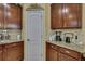 Kitchen view showcasing ample cabinet space, granite countertops, and modern appliances in a functional design at 2387 Bartolo Dr, Land O Lakes, FL 34639