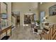 Inviting living room featuring high ceilings, archways, and tile flooring at 2387 Bartolo Dr, Land O Lakes, FL 34639