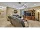 Relaxing living room with comfortable seating, a wooden entertainment center, and ample natural light at 2387 Bartolo Dr, Land O Lakes, FL 34639