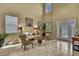Inviting living room featuring high ceilings, tile flooring, and abundant natural light, creating a warm atmosphere at 2387 Bartolo Dr, Land O Lakes, FL 34639